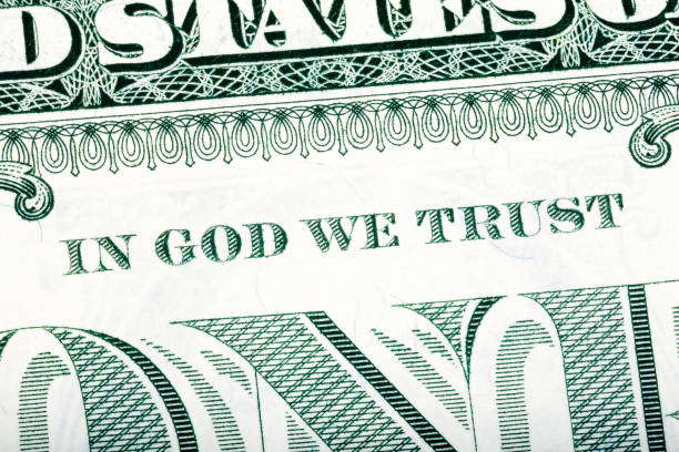 Dollar macro, stacked close-up detail photo. In God we trust sen Dollar macro, stacked close-up detail photo. In God we trust sentence visible. One-dollar bill fragment. U.S. Treasury. dollar bill eagle stock pictures, royalty-free photos & images
