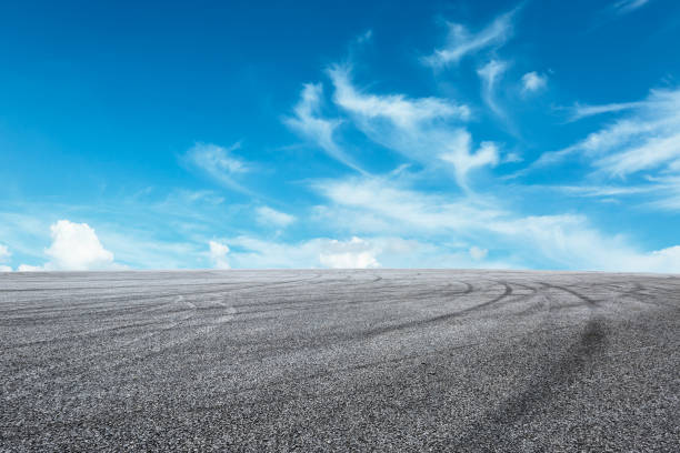 istock Asphalt road circuit and sky clouds with car tire brake 861117514