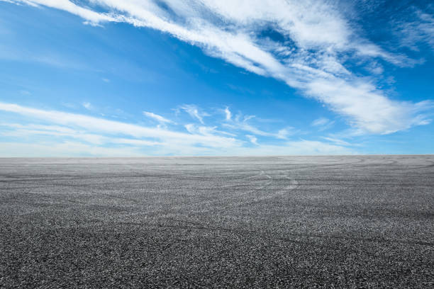 istock Asphalt road circuit and sky clouds with car tire brake 861117624
