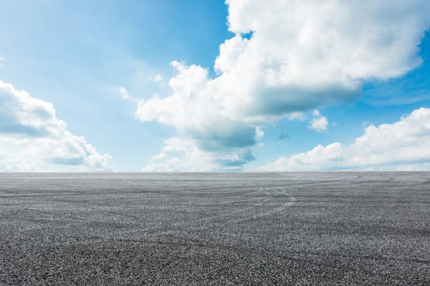 istock Asphalt road circuit and sky clouds with car tire brake 861118140