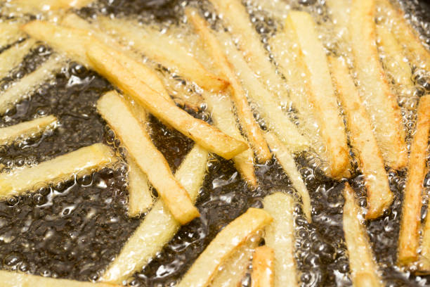 istock French fries fried in a pan 861118470