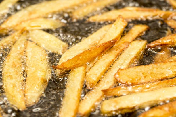 istock French fries fried in a pan 861119028