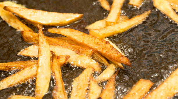 istock French fries fried in a pan 861119316