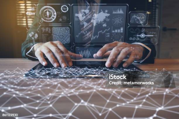 Businessman Using Tablet Pc And Information Communication Technology Concept Iot Paperless Office Stock Photo - Download Image Now