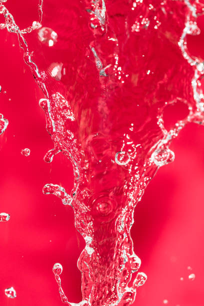 istock spray water on the red background 861126102