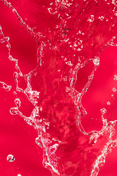 istock spray water on the red background 861126188