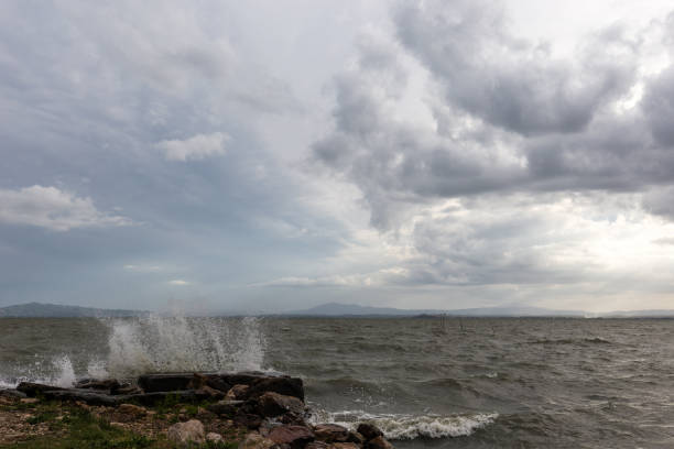 istock Water splashing on rocks and stones, beneath a moody sky 861129516