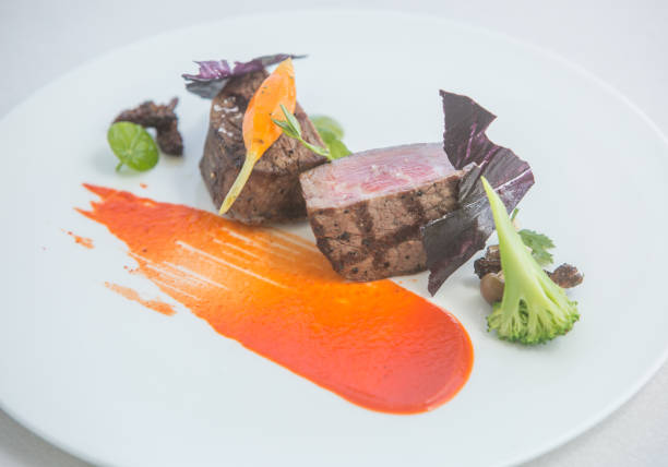 istock Fillet mignon with sauce and vegetables 861129844