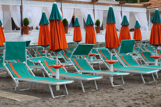 istock Beach chairs and umbrellas on the sand. 861148484