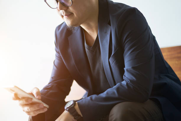 istock Closeup of businessman using smartphone . 861148602