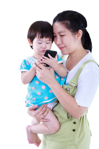 istock Mother with her daughter. Girl using electronic gadget. Isolated on white background. 861148694