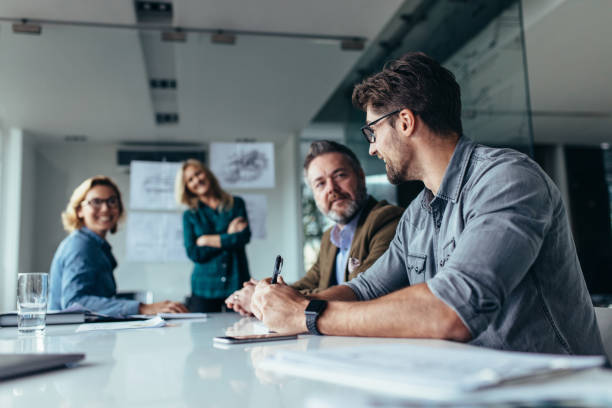 istock Businessman sharing ideas on project to team 861165180