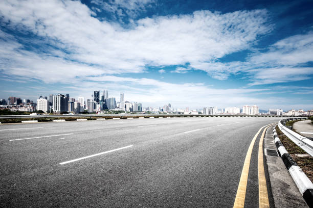 istock empty asphalt road with cityscape of modern city 861165780