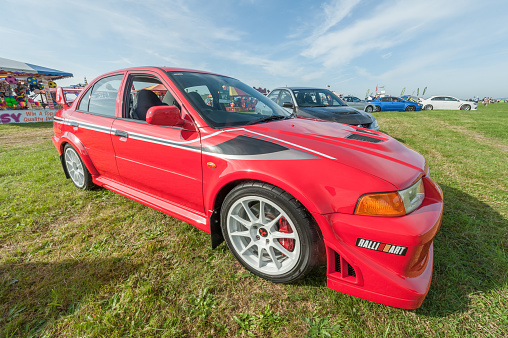 Dunsfold, UK - August 26, 2017: Collection of Mitsubishi Lancer Evolution sports-cars at a gathering of classic and modern vehicles in Dunsfold, UK