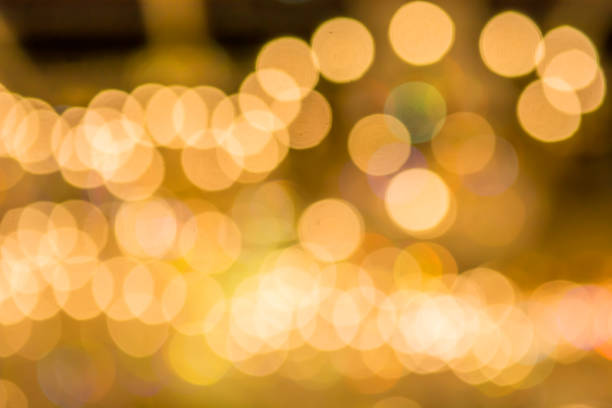 istock Gold bokeh lights and gold shiny sparkles 861168604
