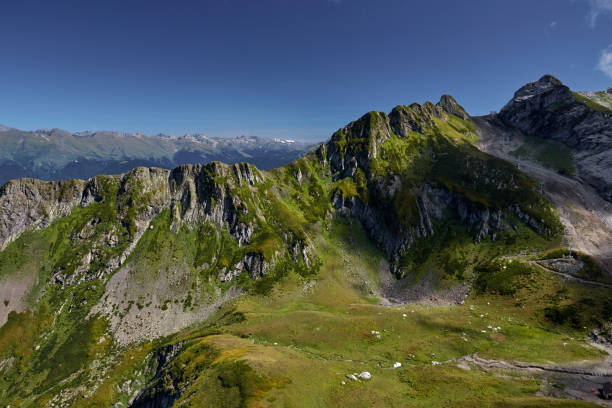 istock Beautiful green mountain landscape with bright blue sky. North Caucasus. 861168934