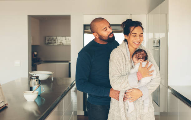 istock Couple with their little baby boy in kitchen 861169324