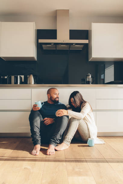 istock Loving couple enjoying a coffee on kitchen floor 861169608
