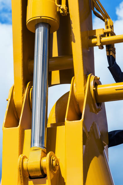 hidráulica tractor amarillo - hydraulic platform hose oil industry industry fotografías e imágenes de stock