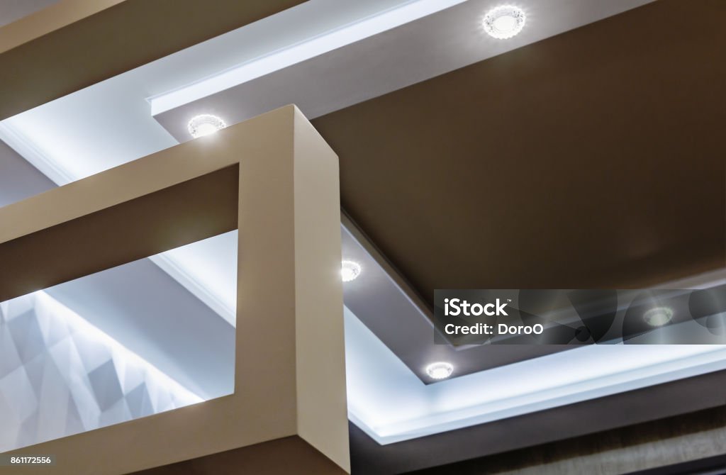 suspended ceiling and drywall construction in the decoration suspended ceiling and drywall construction in the decoration of the apartment or house. focus on coal structures LED Light Stock Photo