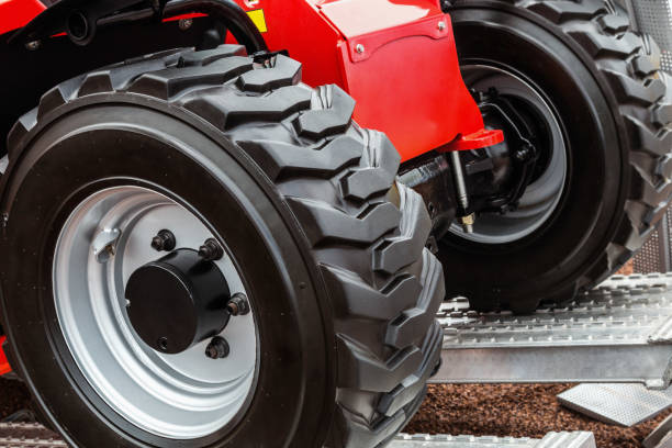 istock wheels of the tractor drive onto 861173314