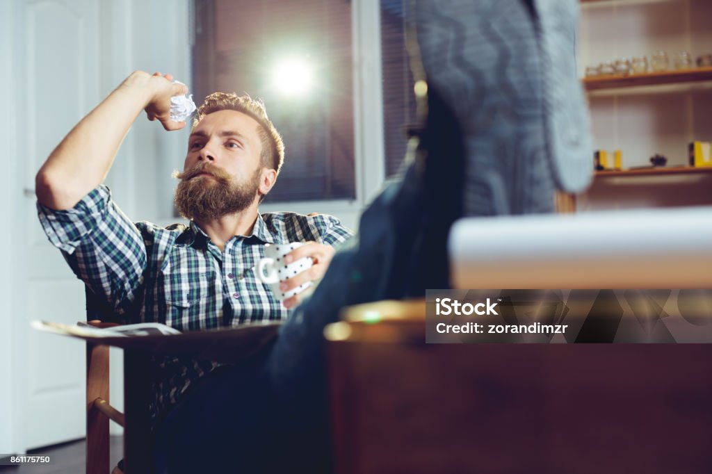 Man Throwing Paper Into Wastepaper Basket Throwing Stock Photo