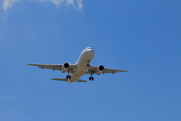 Passenger Airplane Taking Off Into The Blue Sky