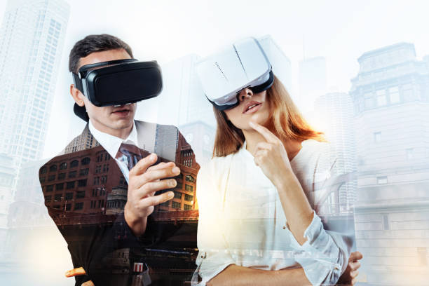 istock Two elegant colleagues observing incredible virtual reality 861181182