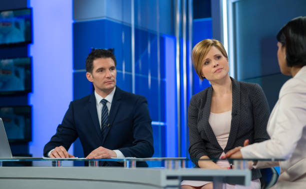 istock Journalists Sitting With Businesswoman 861184074