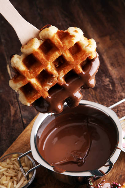 istock Belgium waffles with chocolate sauce. popsicles with chocolate and wafer 861184162