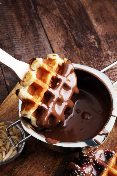 istock Belgium waffles with chocolate sauce. popsicles with chocolate and wafer 861184412
