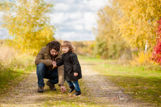 istock Father and daughter walking together, autumn day. 861184594