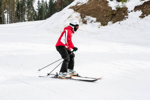 istock skier is skiing down the slope in the woods 861194142
