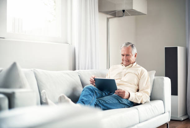 istock He's got the world with him right on the sofa 861202650