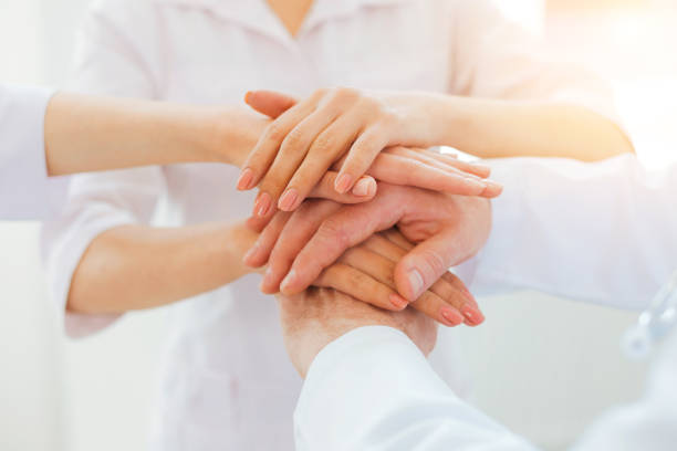 istock Close up look on medical professionals joining hands together 861203028