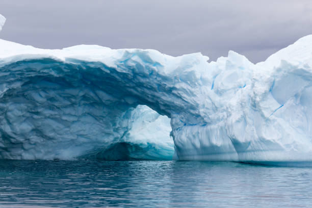 istock A huge cave has been carved in tho this iceberg. 861206150