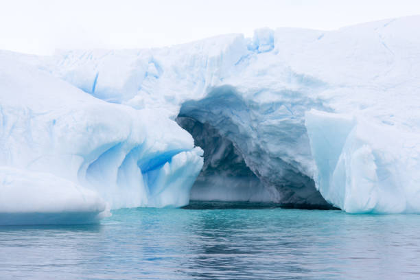 istock A huge cave has been carved in tho this iceberg. 861206154