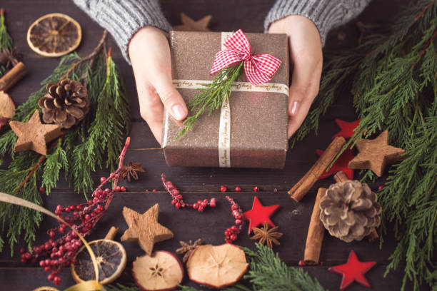 istock Woman hands making Christmas day gifts. 861213206