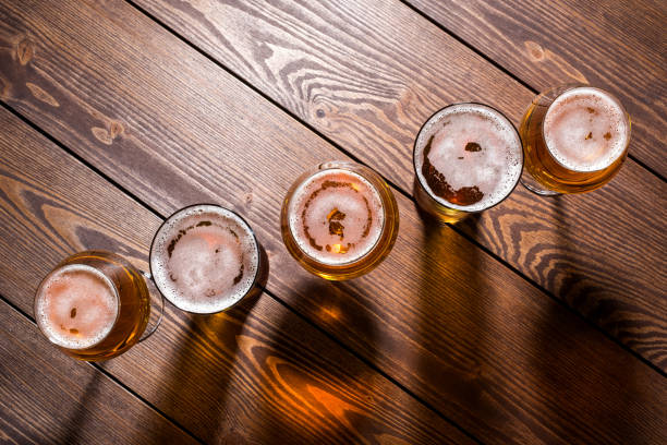 istock Beer glasses on wooden table 861218476