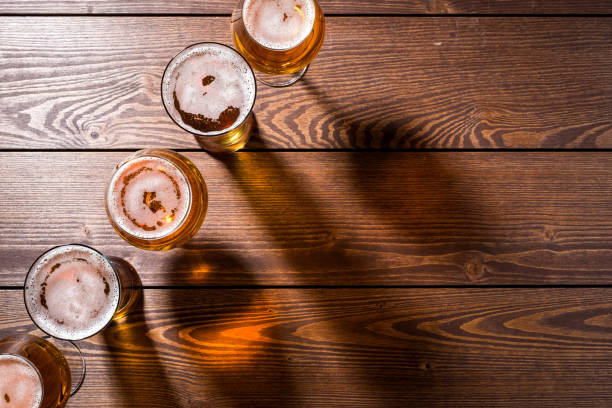 istock Beer glasses on wooden table 861225454
