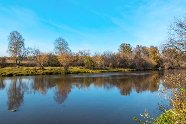 istock bright autumn landscape on the river bank 861227470