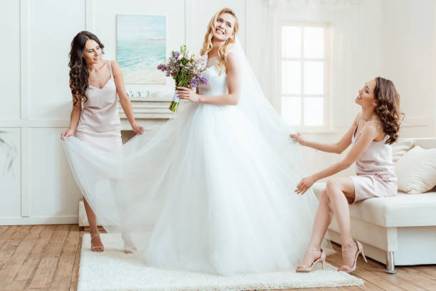 istock bride with bridesmaids preparing for ceremony 861227474