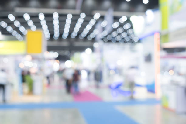 istock Blurred exhibition event in hall with many people on background 861230292