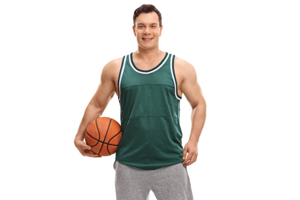 istock Young man dressed in a green jersey holding a basketball 861237256