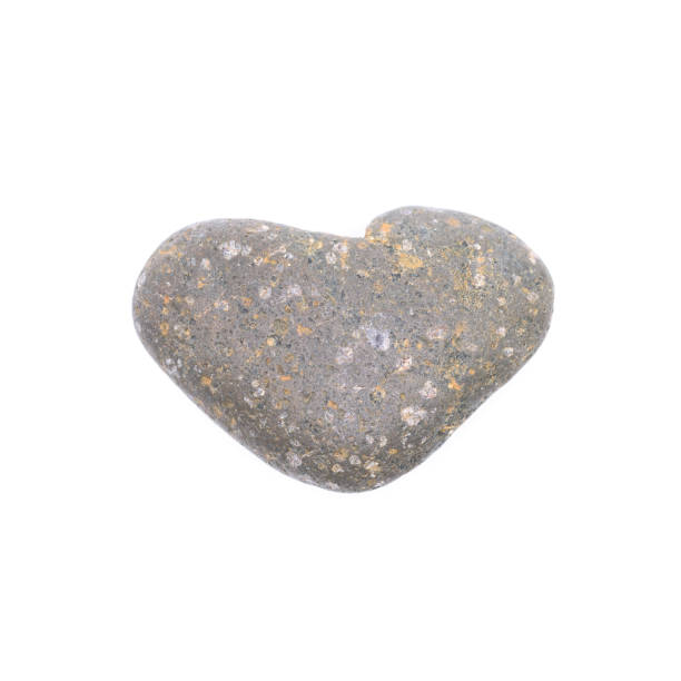 istock A loving heart shaped stone isolated on white background. 861247210