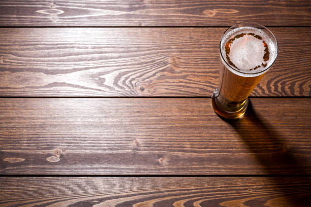 istock Beer glass on wooden table 861248186