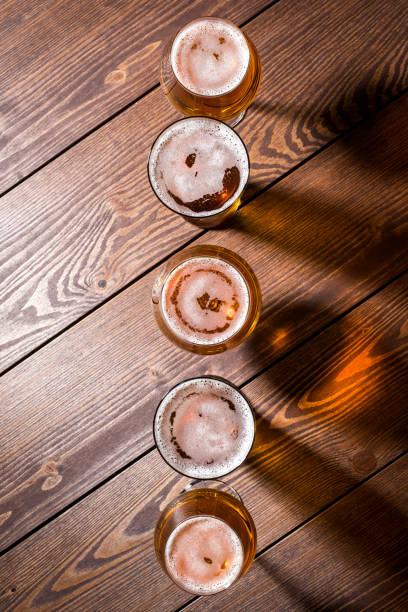 istock Beer glasses on wooden table 861251928