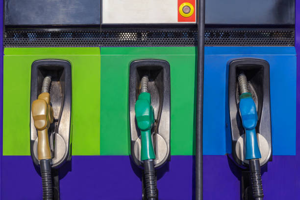 row of fuel nozzles pump on gas service station