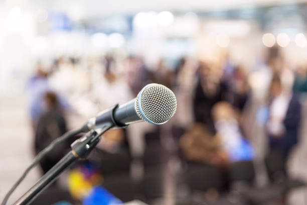 istock Microphone in focus against blurred audience. News conference. 861256228