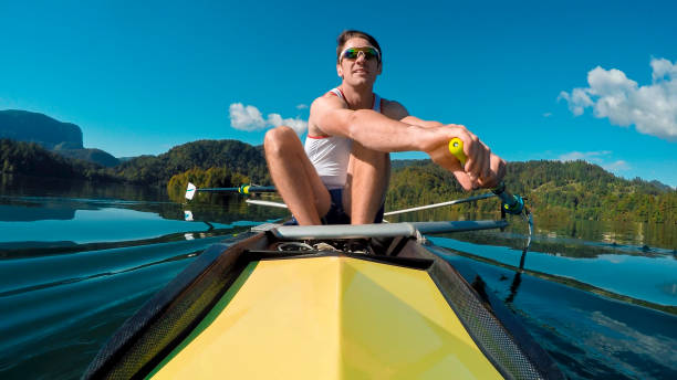istock Male athlete in yellow coxless pair rowing in sunshine 861260714
